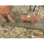 3 cast iron pigs