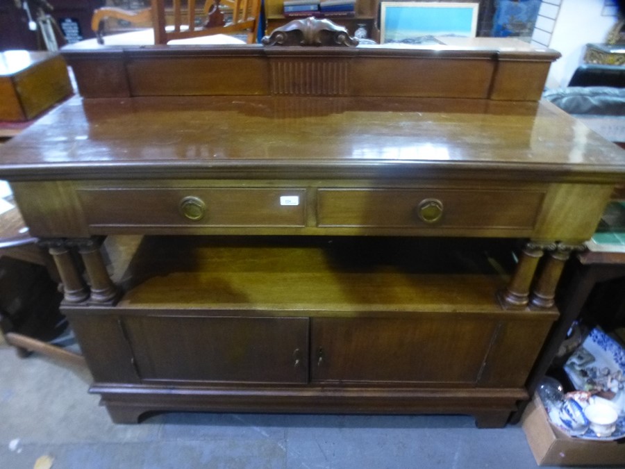 A mahogany two tier buffet having two drawers