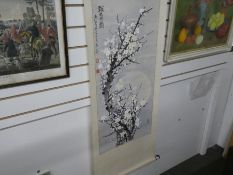 A Chinese watercolour scroll painting of flowering trees, signed and two other Chinese watercolours