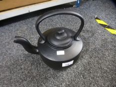 A cast iron kettle