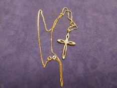 9ct yellow gold cross marked 375 on 9ct yellow gold neck chain, marked 9K, gross weight 4.3g