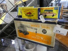 A Dinky Coles mobile crane, No. 571, and three Matchbox cars - all boxed