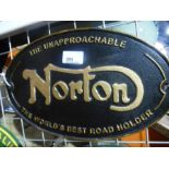 Black and gold Norton sign