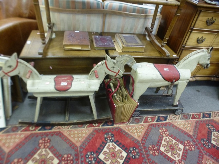 Two wooden childs rocking horses and sundry record.