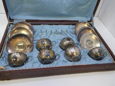 A cased lot of Egyptian silver six cups and saucers, with floral decorative engraved design. 1916-19