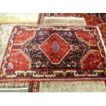 A Hamadan style rug having central diamond motif 217x136cms