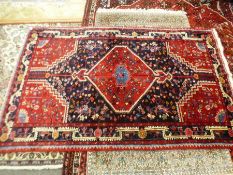 A Hamadan style rug having central diamond motif 217x136cms