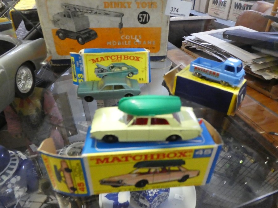 A Dinky Coles mobile crane, No. 571, and three Matchbox cars - all boxed - Image 2 of 3