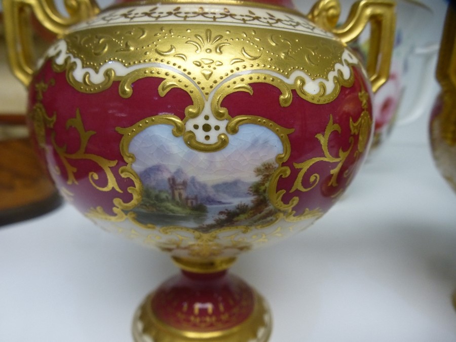 A pair of Coalport small urns and covers having landscape panels and all over gilt decoration. Also - Image 2 of 3