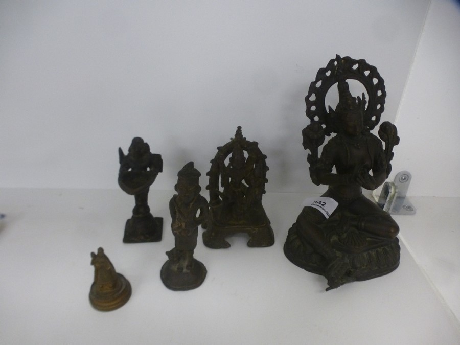An Oriental bronze goddess and four other figures