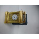 A French miniature carriage clock with fitted case, the rear stamped D.C