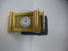 A French miniature carriage clock with fitted case, the rear stamped D.C