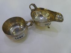 A silver lot comprising of a gray boat with a decorative rim, hallmarked Birmingham 1941 JB Chatterl