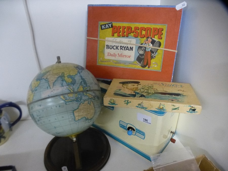 A toy washing machine a kay peep-scope , Chad valley globe and one other item
