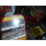 A quantity of soccer and sport related annuals and magazines.