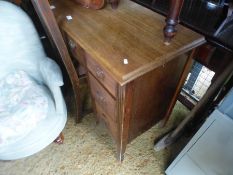 A mahogany desk on splay feet
