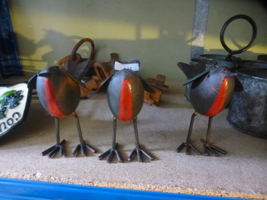 Three tinplate robins