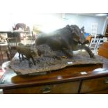 A wood carving of lying Boar and young, 78 cms