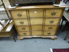 A reproduction mahogany chest having four long drawers on ogee bracket feet