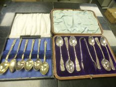 A set of Victorian decorative cased silver teaspoons with sugar tongs included, stamped Sheffield 18