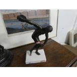 A vintage metal figure of a Discus thrower on a recent marble base, height approx 30 cms