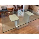 Contemporary glass top dining table.