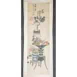 Chinese scroll painting of flower arrangements.