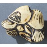 Netsuke of a fish in a group of shells, 19th c.