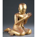 Burmese gilt wood kneeling Buddhist attendant.