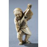 Netsuke of a man holding a fan, 19th c.