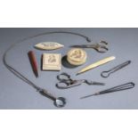 Sewing kit with 10 sewing implements.