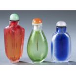 3 Glass overlay snuff bottles, 19th c.