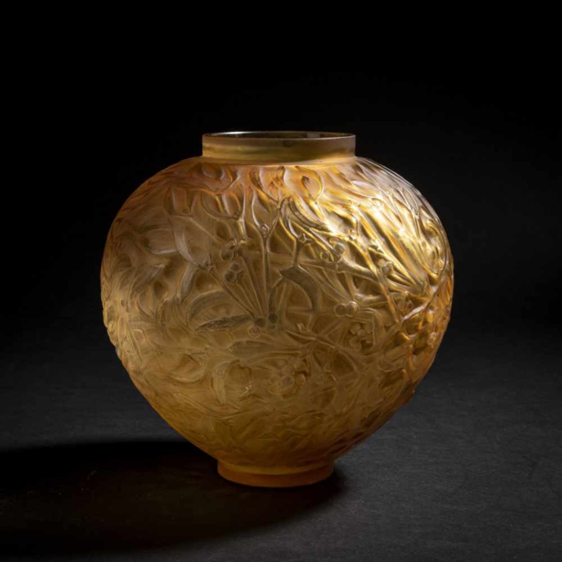 René Lalique, 'Gui' vase, 1920'Gui' vase, 1920H. 17 cm. Amber mould-blown glass ('Butterscotch'),