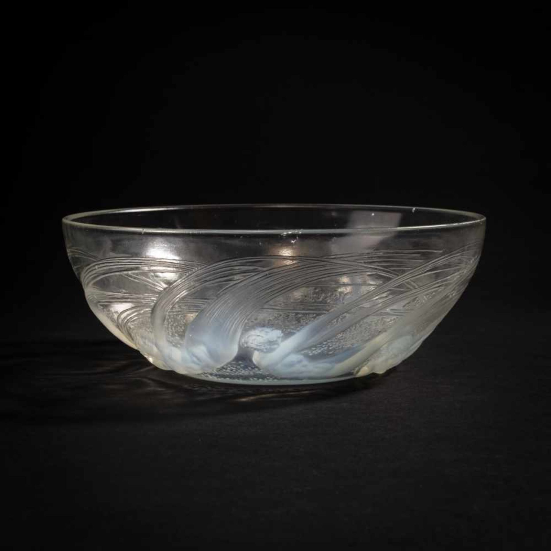 René Lalique, 'Ondines' bowl, 1921'Ondines' bowl, 1921D. 21 cm. Clear, moulded glass, opalescent,