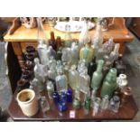 A collection of 'dug-up' bottles & pots including Bovril jars, drinks, medicine, coloured glass,