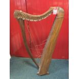 A mahogany clarsach, the instrument with decorative bone/ivory button inlay pegged for 31 strings,