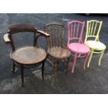 Four bentwood chairs - an armchair with circular shell pressed seat, a pair painted with similar