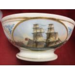 A Victorian porcelain bowl painted with oval marine scene in gilt shell scrolled frieze, decorated