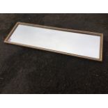 A rectangular mirror in gilt frame. (36in x 12in)