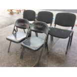 A set of three upholstered chairs on arched frames; and a pair of folding metal chairs. (5)