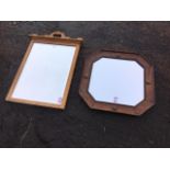 A Victorian oak framed mirror with bevelled plate, the moulded top rail with scroll carved