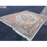 A Turkish style wool carpet, woven with busy floral designs centering with floral medallion on ivory