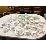 A Royal Doulton twelve-piece teaset decorated in the Apple Blossom pattern; a Royal Standard six-