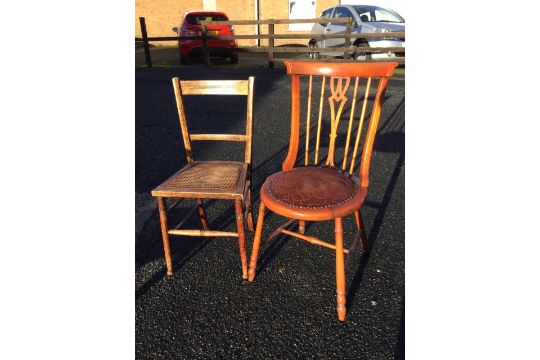 An oak bedroom chair with spindleback above a circular upholstered seat with brass studding, - Image 1 of 3