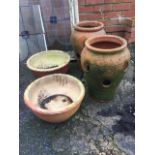 A pair of salt glazed stoneware bowls with scrafitto decoration to rims; and a pair of baluster