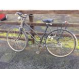 A 1950s BSA ladies bicycle with sprung seat, lights driven by dynamo, pannier rack, stand, three