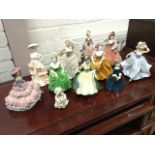 A collection of lady figurines - seven Coalport fashion models, a Royal Worcester Camille after