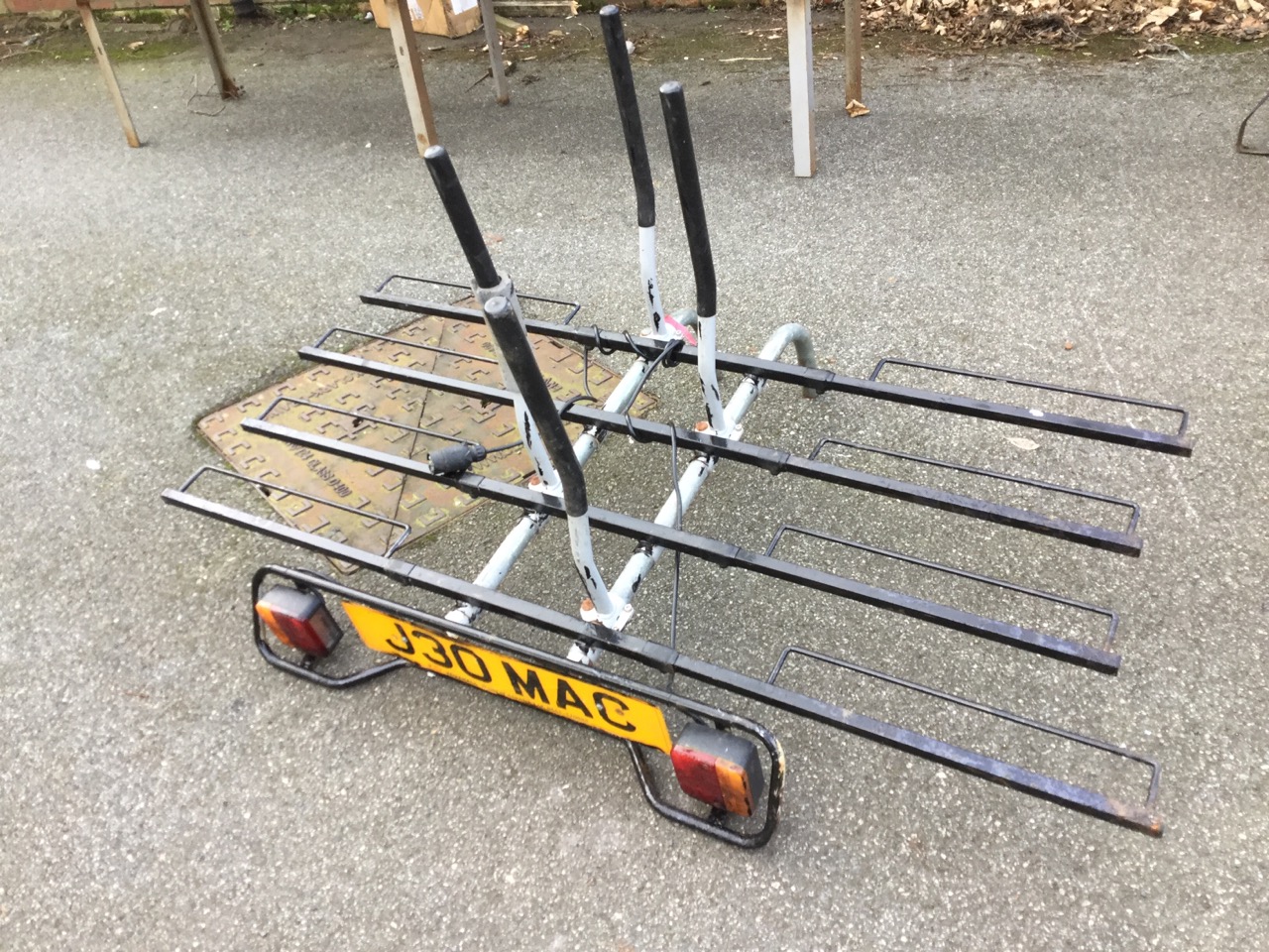 A vehicle bike rack for four bicycles, wired with numberplate electrics.