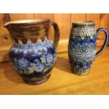 A Doulton Lambeth stoneware jug embossed with thistle and leaf friezes having applied moulded