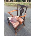 A nineteenth century mahogany Chippendale style armchair, the back with pieced fretwork splat having